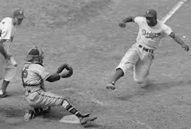 Jackie Robinson becomes a player on the Brooklyn Dodgers