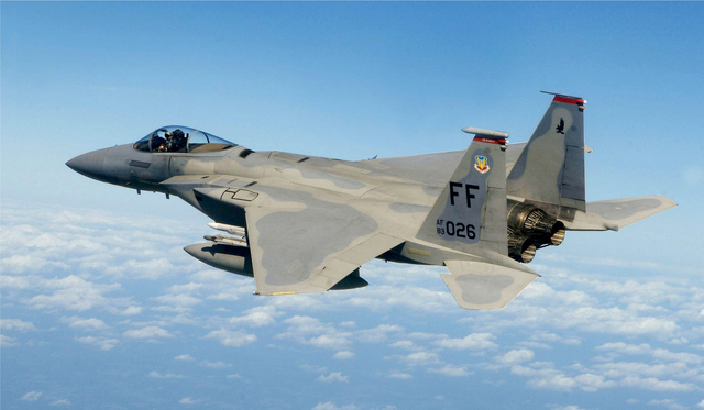 First U.S. forces (F-15 Eagle fighters from Langley Air Force Base, Va.) arrive in Saudi Arabia,