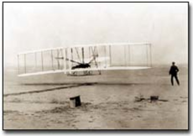 Orville and Wilbur Wright make first powered, sustained, and controlled flight in a heavier-than-air flying machine