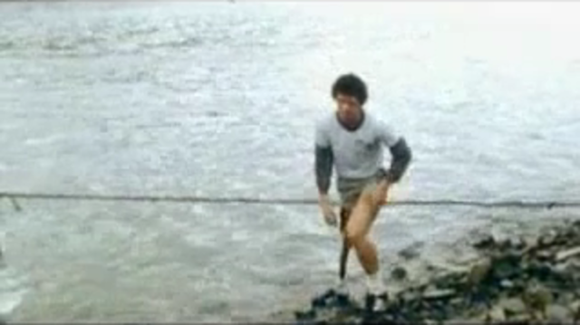 Terry Fox dips his leg in the Atlantic
