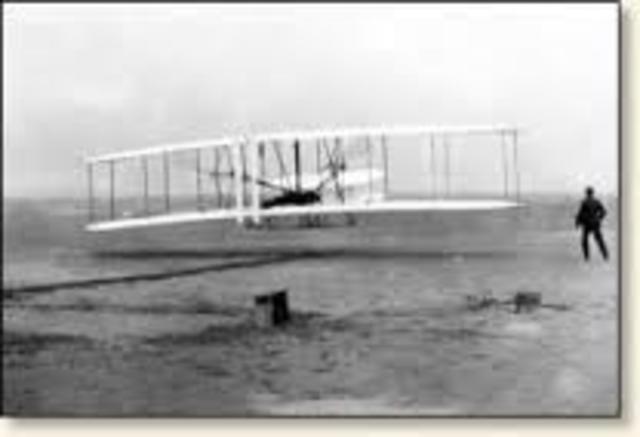 The first powered flight by the Wright Brothers.