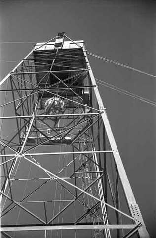 The Gadget is hoisted atop 100-foot tower.