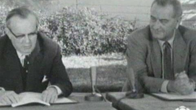 Canada signs the Automobile Pact