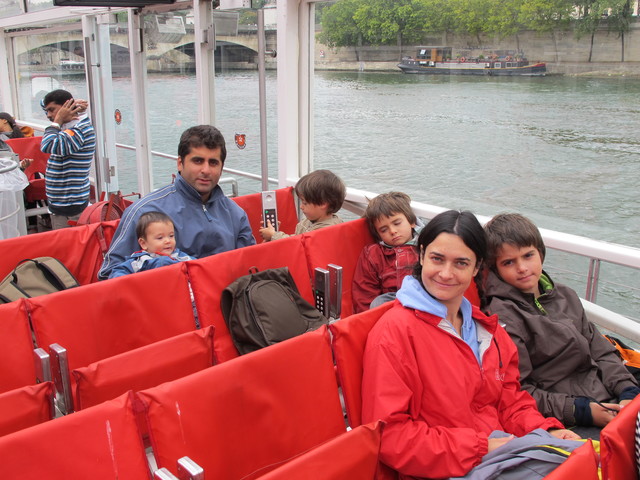 I visited Paris . I was with my uncle , my mother , my brother and my cousin. We sailed by Seine River.