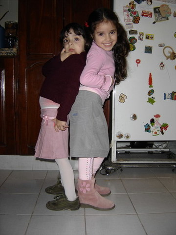 My cousin Lourdes and i danced in the kitchen.