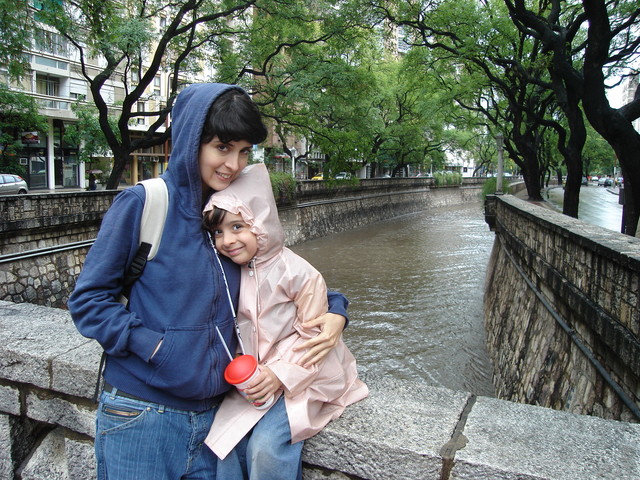 My mother and i walked under the rain.