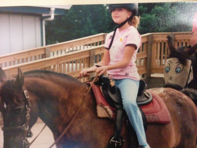 Riding around on my first horse on the family farm.