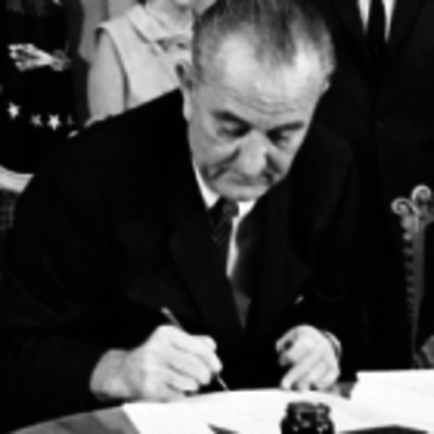 L.B Johnson signs ESEA legislation