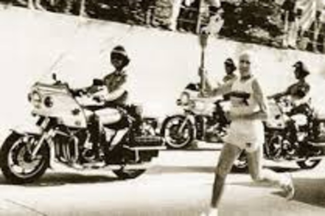 Louis runs the Olympic Torch in Naguno, Japan