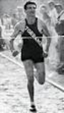 Louis begins competitive running.