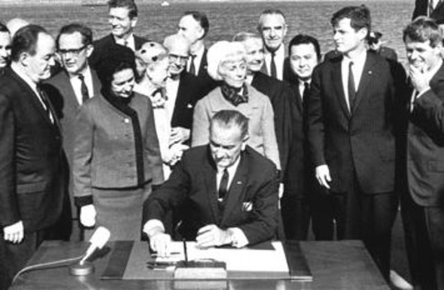 Lyndon Johnson signs the immigration Act of 1965