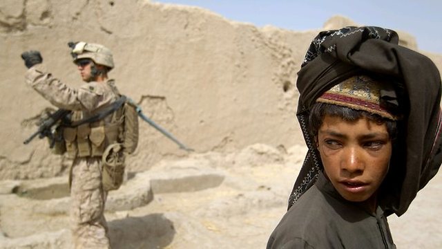 Parvana cuts her hair and dresses like a boy