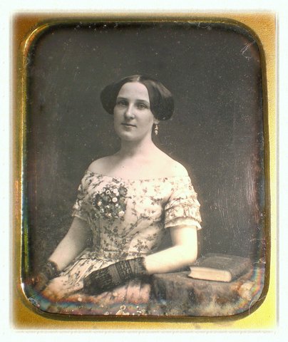 Hairstyles of the time were padded wings