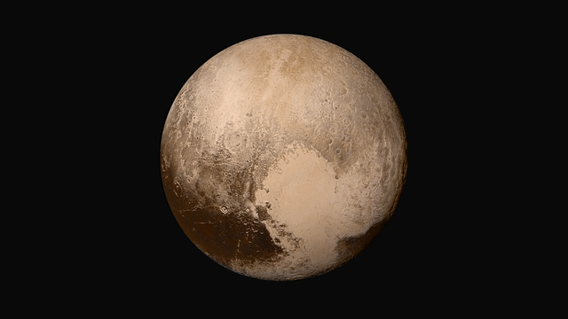 Pluto demoted to "dwarf planet" status.