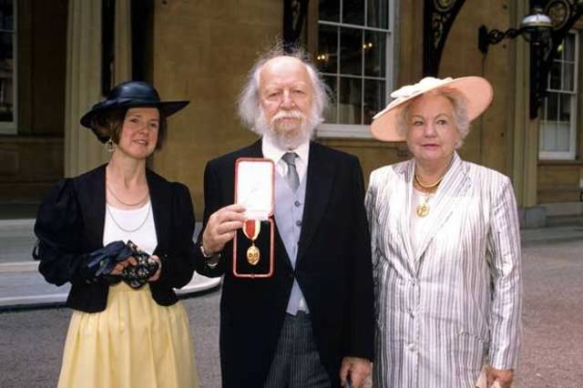 Knighted by Queen Elizabeth II at Buckingham Palace