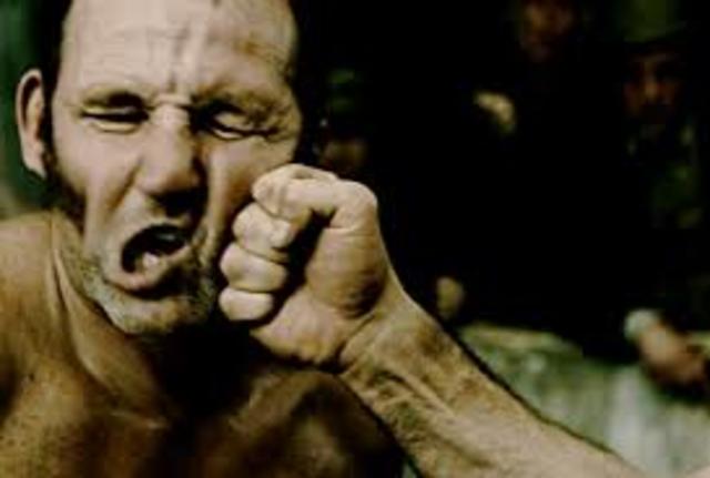 Lennie gets into a fight with and breaks Curley's hand.