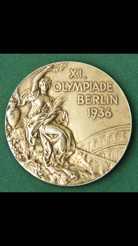 Jesse Owens wins 4 gold medals at olympics in Germany