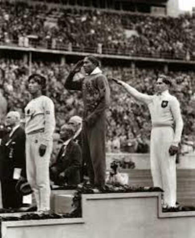 Jesse Owens wins four Gold Medals at Olympics in Germany