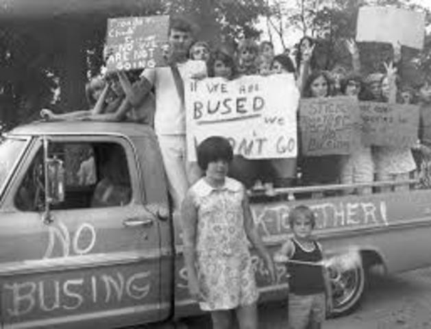 Busing is used as a controversial way to integrate schools