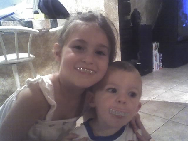 Cain and I with our "Grillz"