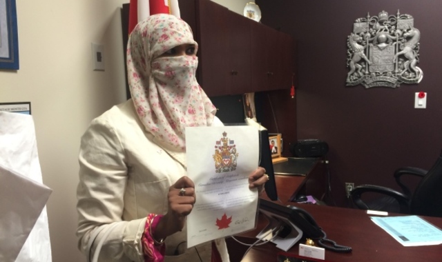 Ishaq Takes Citizenship Oath Wearing Niqab