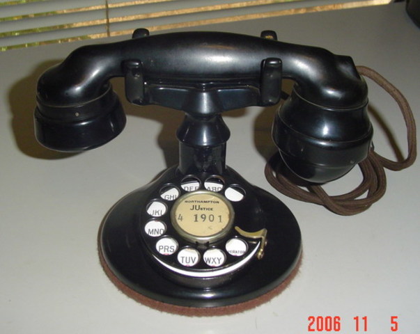 Bell introduced the first desktop cradle telephone, made by Western Electric.