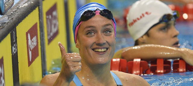 wins three gold medals