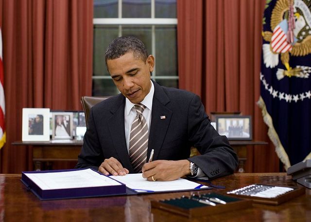 President Obama signs an executive order to raise minimum wage