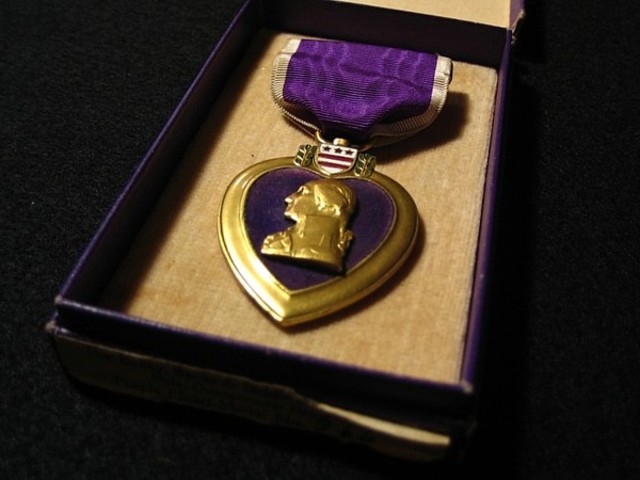 Issue of the purple heart to John C. Laing