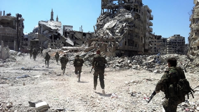 Rebeldes y Régimen en Homs.