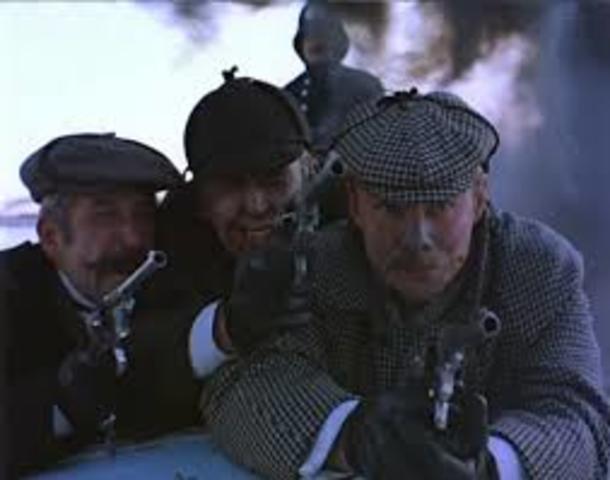 Inspector Lestrade, Holmes and Watson chase the Aurora in a police boat.
