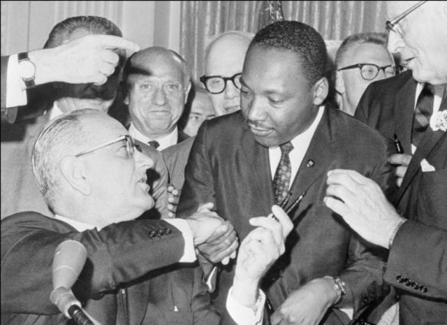 Lyndon Johnson Signs into Law the Civil Rights Act
