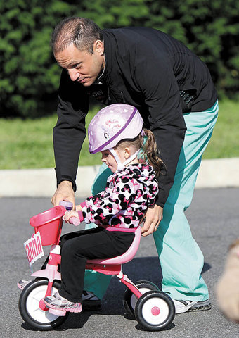 Learns to ride a tricycle