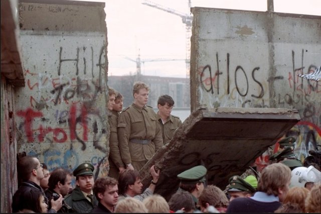 The Berlin Wall falls