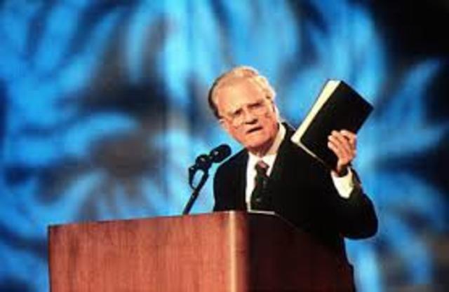 Billy Graham gives sermons over the radios and in churches and schools