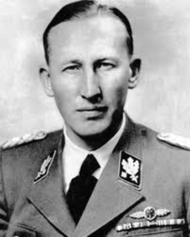 SS official Reinhard Heydrich holds Wannsee Conference to present the final solution