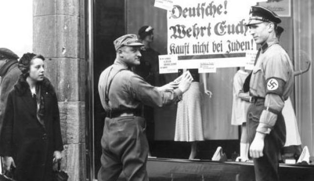 Kristallnacht "Nazi officials have anti-semitic signs put up"