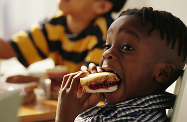 A person eats a food allergen