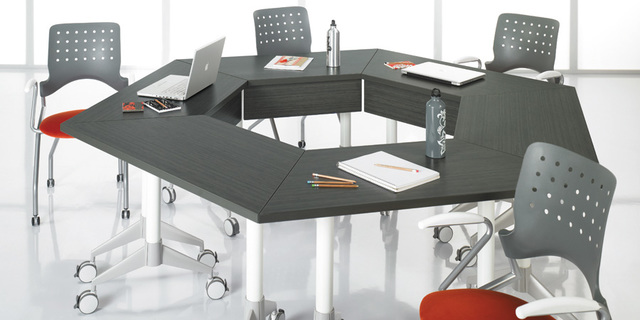 student desks replaced by small tables