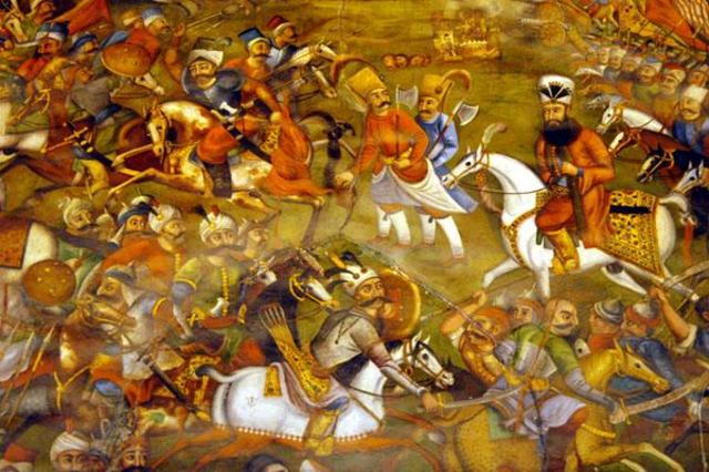 The Ottoman and Safavid armies clash at Chaldiran