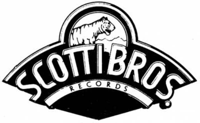Signs with Scotti Bros. Records