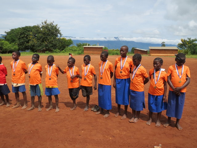 "I came back from my spying foray one afternoon to find her playing 'Mother May I?' with half the villages children." pg.111 Leah