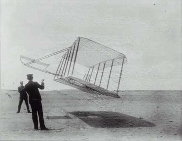 Wright Brothers test out second glider.