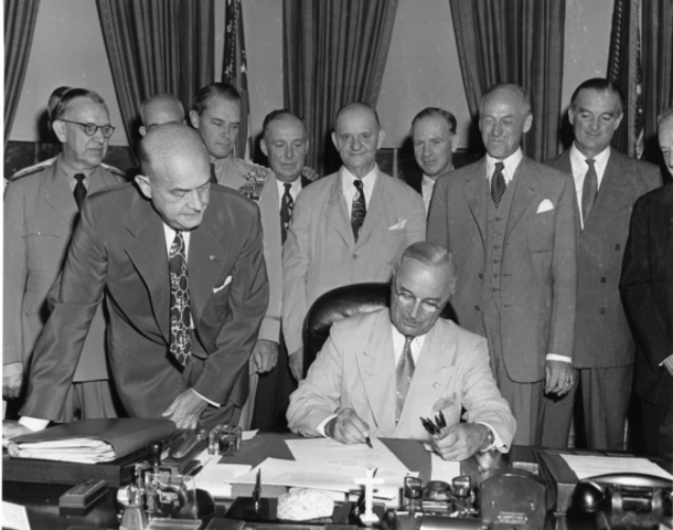 President Truman signs the Atomic Energy Act of 1946.