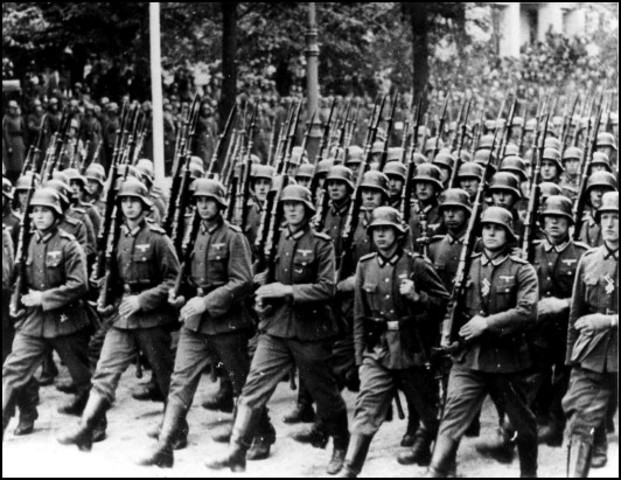 Hiltler defies the treaty of versailles