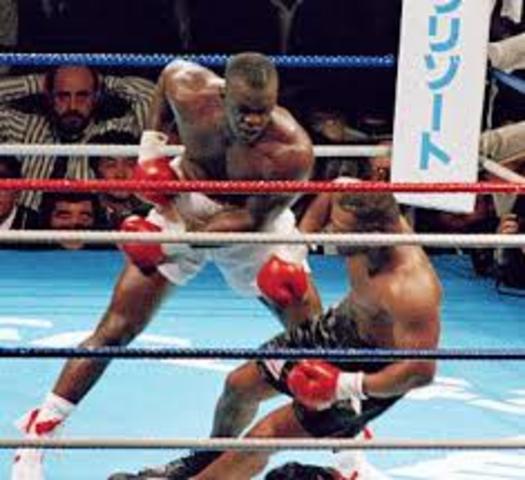 Buster Douglas upsets Mike Tyson with a 10th round knockout