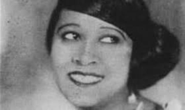 Edith Wilson, a black singer, sung her song "Black and Blue" on stage draped in all white.