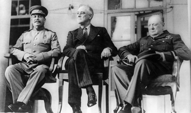 Winston Churchill, Franklin Roosevelt and Joseph Stalin meet at Yalta to discuss post-war Europe
