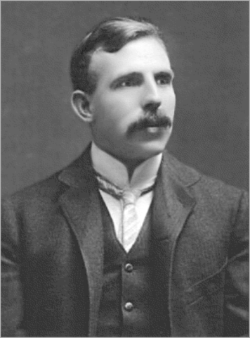 Ernest Rutherford demonstrated that the atom has an internal structure of a small, dense nucleus about which negatively charged electrons circle in orbits.