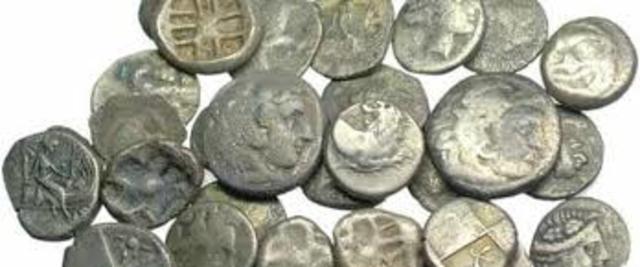 1000 B.C.: FIRST METAL MONEY AND COINS